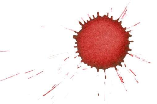 the dried splatter of a red ink drop, isolated on white